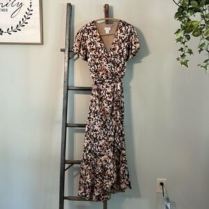 Nicole Miller multi-colored faux wrap dress. Top of dress is lined.